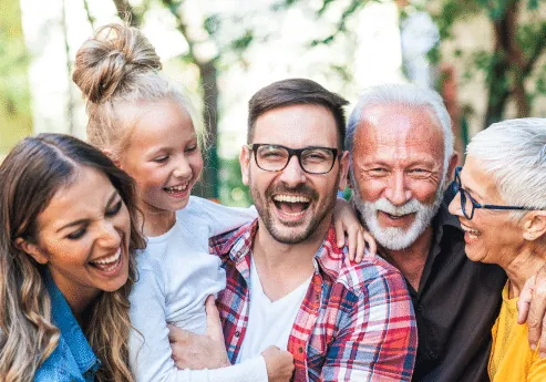 A happy multi-generational UK family outdoors