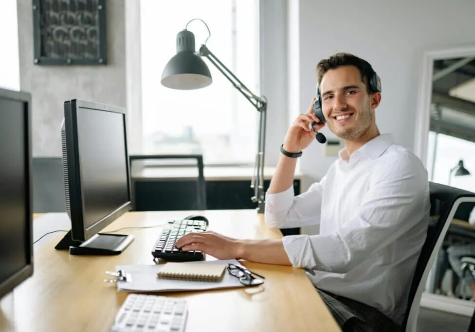 A life insurance broker with a headset ready to discuss your options by phone